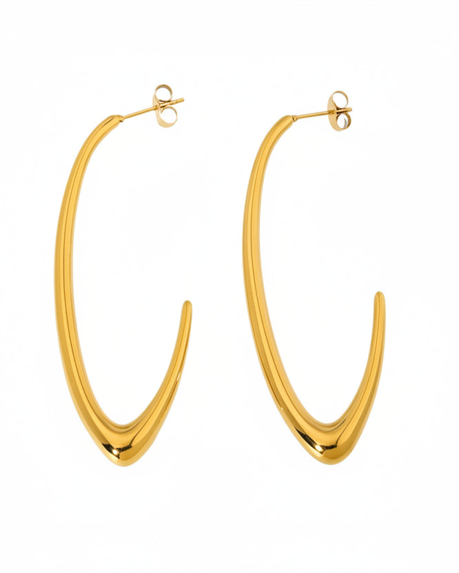 Gold hoop earrings on a white background
