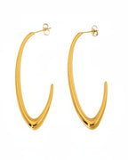Gold hoop earrings on a white background