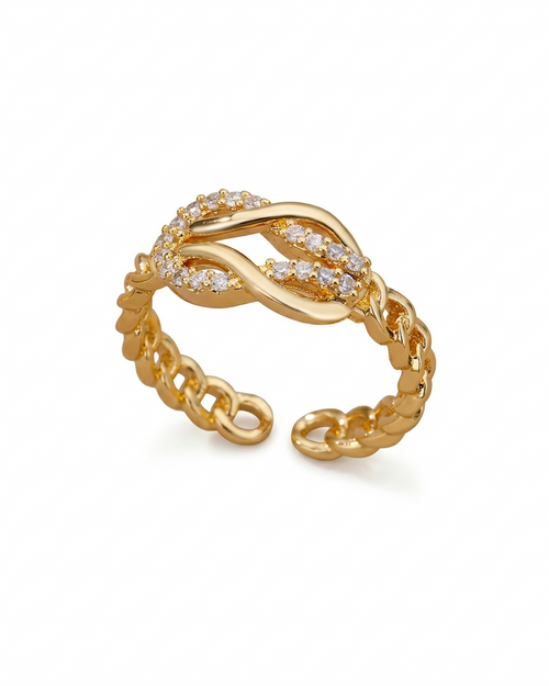 Gold ring with diamond accents on a white background