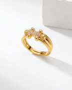 Gold ring with gemstones on a white background