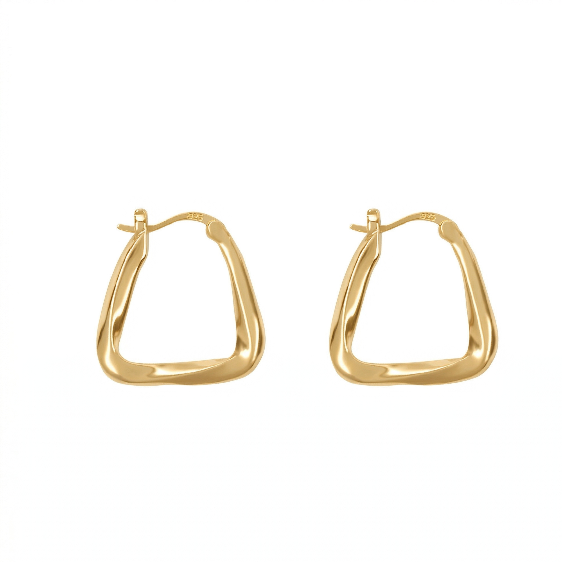 Gold hoop earrings on a white background